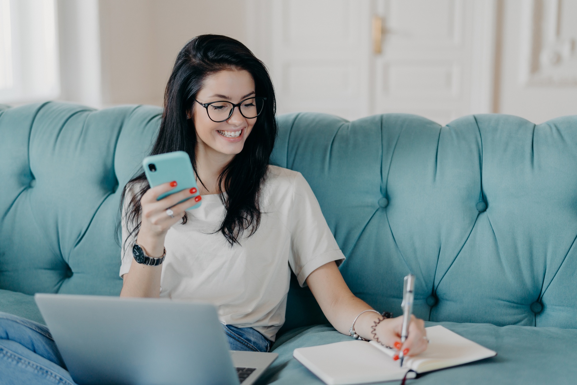 Female copywriter concentrated on remote job, prepares publication, watches webinar